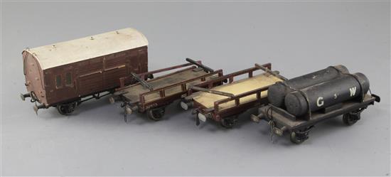 A GW fuel tanker wagon, no.5, a horse box, in brown, an LMS flat wagon, no.46218 and an NE flat wagon,